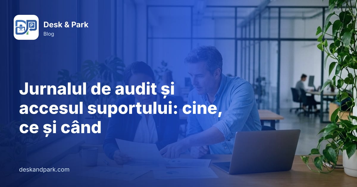 Doi colegi parcurg împreună rapoarte tipărite și un laptop, la un birou de lângă fereastră
